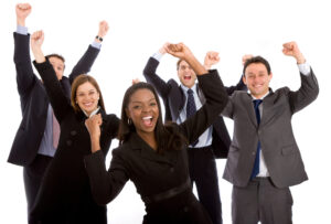 Five business people celebrating with their hands in the air